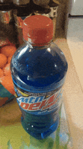 a bottle of mountain dew sits on a kitchen counter