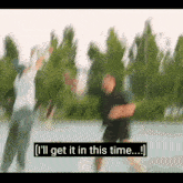 a blurry picture of two people dancing with the words i 'll get it in this time