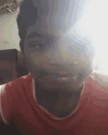 a close up of a man 's face with the sun shining on it