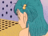 a cartoon girl with blue hair and a yellow flower in her hair is looking down .