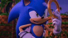 sonic the hedgehog in a video game holding a ring