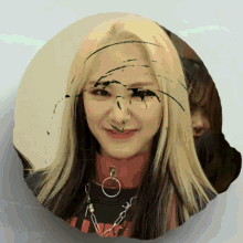 a picture of a girl with green paint on her face and a red collar