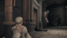 a man and a woman are standing in a dark room .