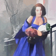 a woman in a blue dress is holding flowers