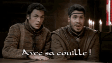 two men are sitting at a table with the words avec sa coulle
