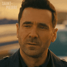 a close up of a man 's face with saint-pierre written in the corner