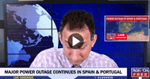 a man is crying in front of a screen that says power outage in spain and portugal