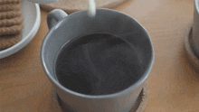 Putting Milk In The Coffee Two Plaid Aprons GIF - Putting Milk In The Coffee Two Plaid Aprons Pouring Milk Into Coffee GIFs