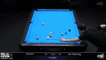 a pool table with a blue cloth says diamond on it