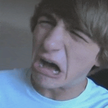 a close up of a man making a funny face