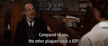 a man in a suit and tie is talking to a woman with the words compared to you the other plagues were a joy below him