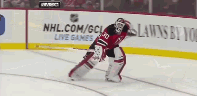 Martin Brodeur scores a goal NHL New Jersey Devils goalie animated gif
