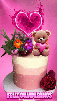 a birthday cake with a teddy bear holding a heart and the words " feliz cumpleanos " below it