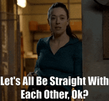 a woman in a blue sweater is standing in a doorway with the words let 's all be straight with each other ok