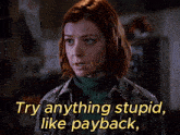 a woman says " try anything stupid like payback " in front of her face