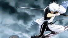 a man in a samurai outfit is holding a sword in his hand .