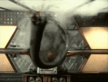a helicopter is flying through the air and smoke is coming out of it .