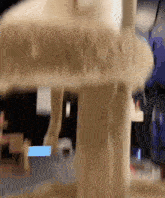a blurred image of a person standing next to a pole
