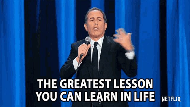 a man in a suit and tie is holding a microphone and says the greatest lesson you can learn in life netflix