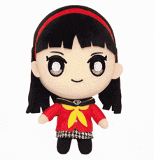 a stuffed toy of a girl with a red jacket and a yellow scarf