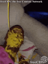 a picture of a person covered in a yellow substance with the words freecdn at the bottom