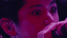 a close up of a person 's face with the letter d on the bottom right
