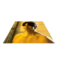 a man without a shirt is standing in front of a tiled wall