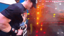 a man wearing a t-shirt that says ' nc ' on it is hugging another man .