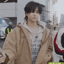 a man wearing a jacket that says columbia on the front