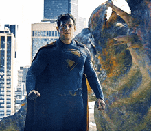 a man in a superman costume with a cape