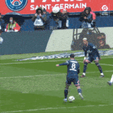 a soccer player with the number 8 on his jersey is about to kick the ball