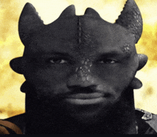 a man with a beard and horns looks like a devil