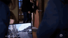 two men are standing in front of a painting that says chicagomed on it