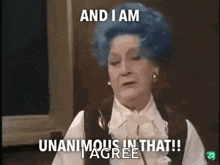 a woman with blue hair says " and i am unanimous in that i agree "