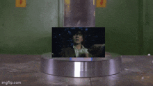 a picture of a man is being displayed on a metal circle with the url imgflip.com at the bottom