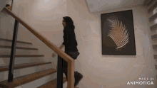 a woman is walking down a set of stairs made by animatica