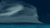 a computer generated image of a waterfall in the middle of the ocean