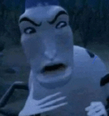a close up of a cartoon character 's face with a scary expression .