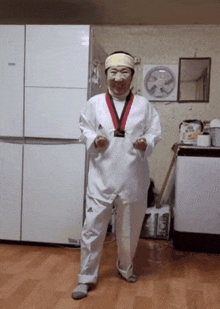 a woman in a taekwondo uniform is standing in front of a refrigerator