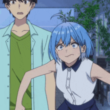 a man and a girl are standing next to each other and the girl has blue hair
