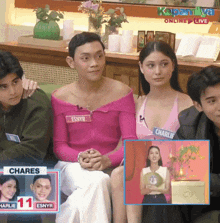 a group of people sitting in front of a sign that says kapamilya