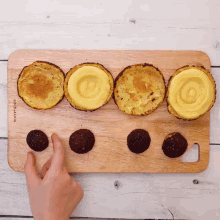 a wooden cutting board that says lock & lock on the bottom