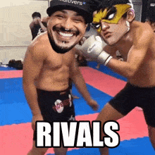 a boxing match with the words rivals written on the mat