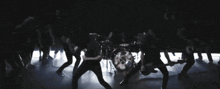 a group of people are playing instruments on a stage .