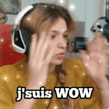 a woman wearing headphones says " j suis wow "