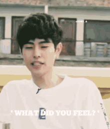 a young man in a white t-shirt is asking what did you feel