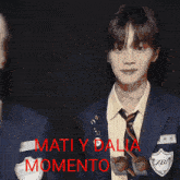 a man in a suit and tie with the words matiy dalia momento on the bottom right