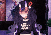 a girl with horns and a pentagram on her shirt