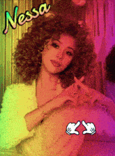 a woman with curly hair has the name nessa written above her