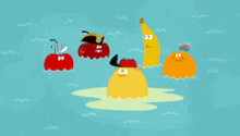 a group of fruits are floating on top of a body of water